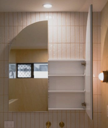 The Eterna Arch mirror cabinet with one door open, showing the shelves inside